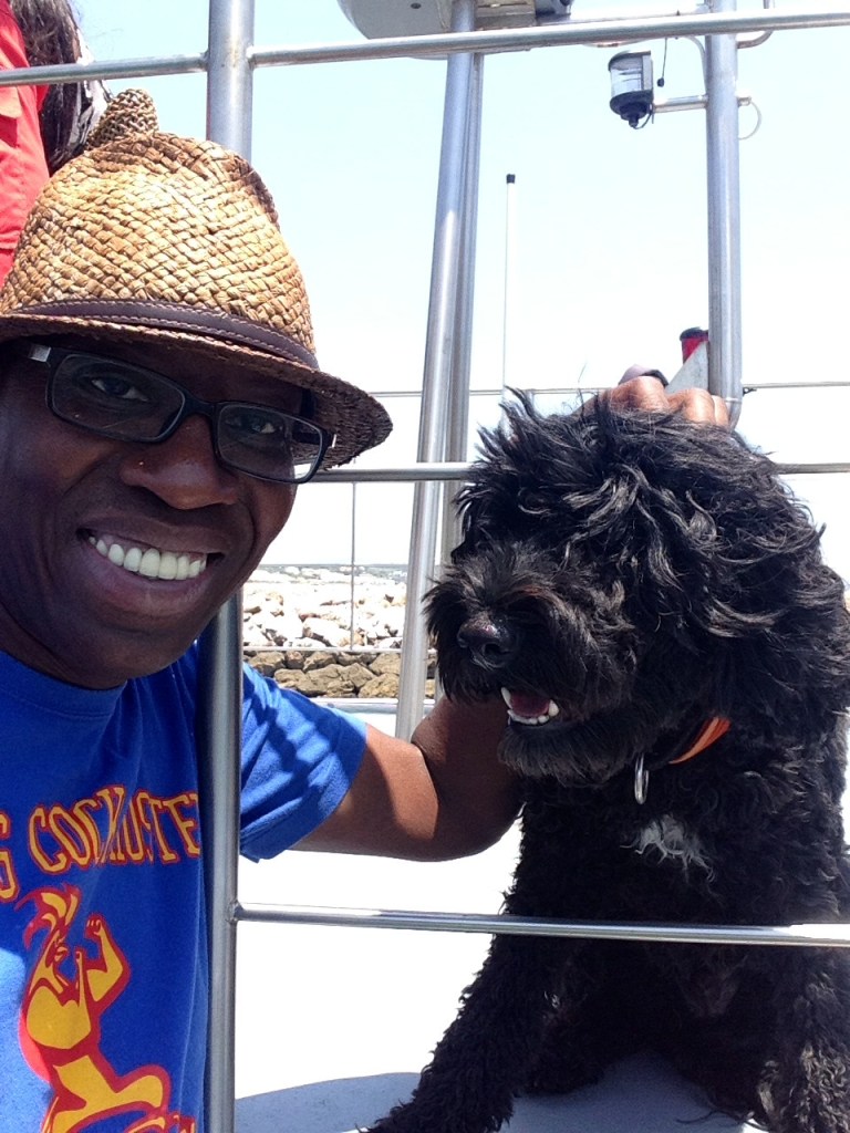 With Zuka, the dolphin-spotting Portuguese water dog, aboard the Days Of Adventure